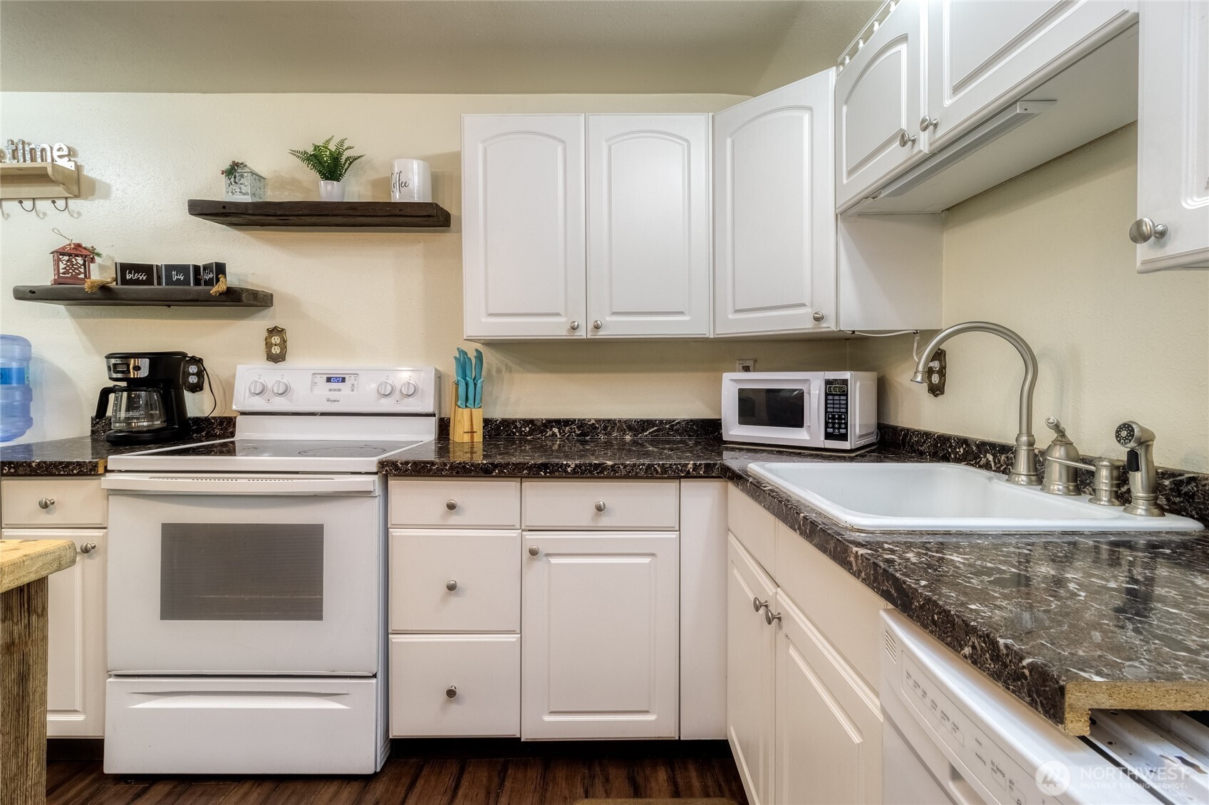 48 Blue Jay Loop Walla Walla, WA 99362 - Photo 9 of 21 a kitchen with white cabinets and a sink