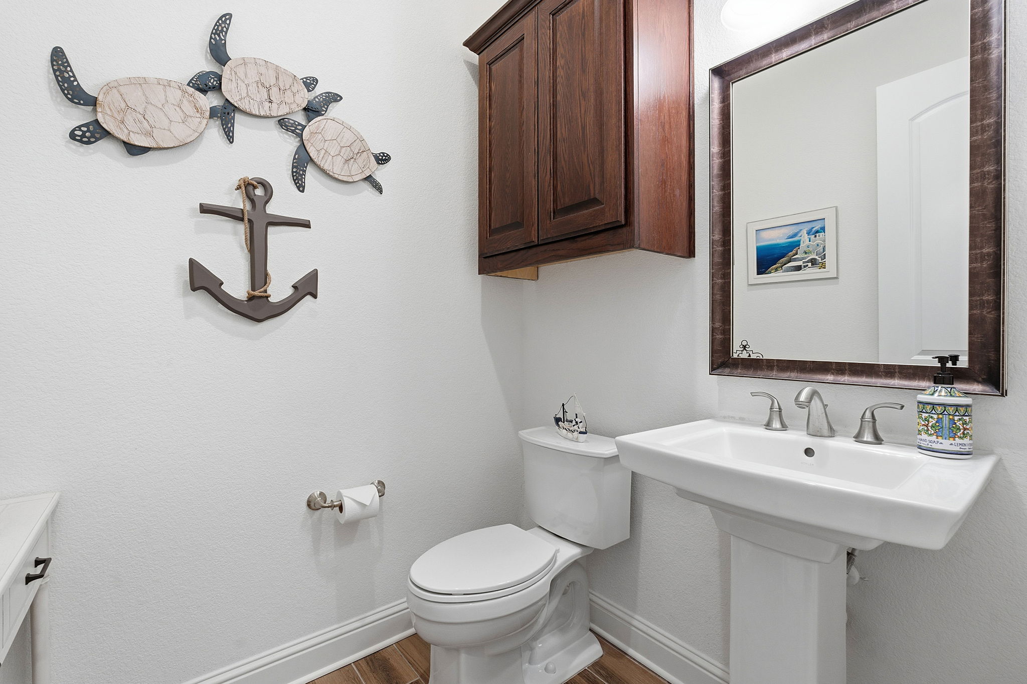 2824 Wedgescale Pass Leander, TX 78641 - Photo 26 of 40 Powder bathroom downstairs for guests