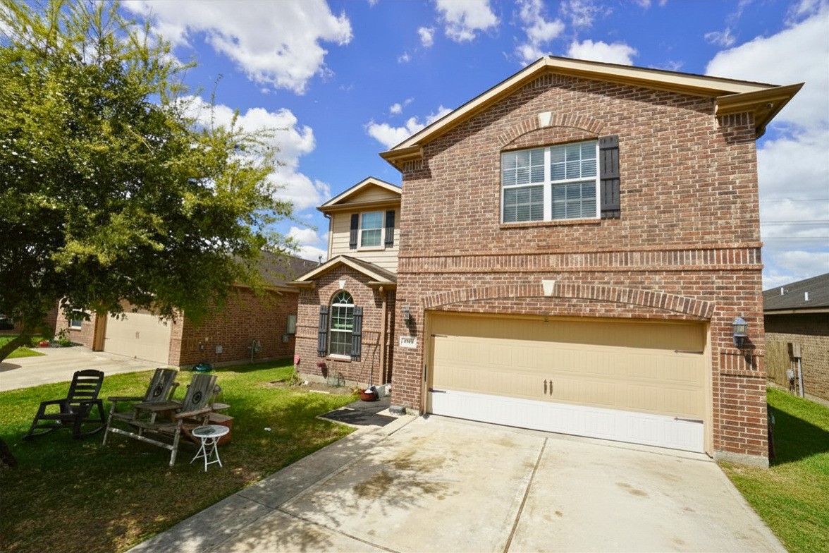 1835 Garnet Breeze Drive Rosharon, TX 77583 - Photo 1 of 19 a front view of a house with garden