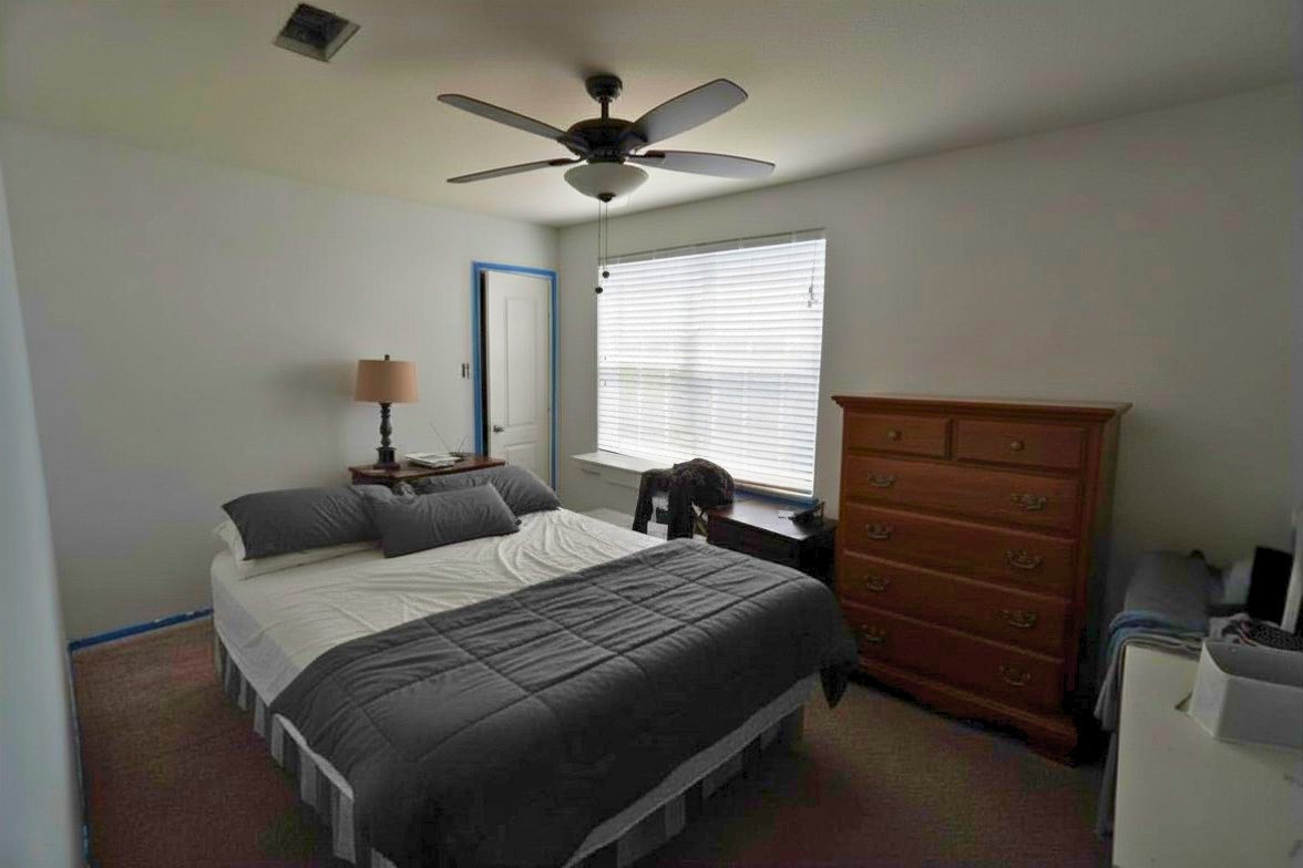 1835 Garnet Breeze Drive Rosharon, TX 77583 - Photo 12 of 19 a bedroom with a bed and a ceiling fan
