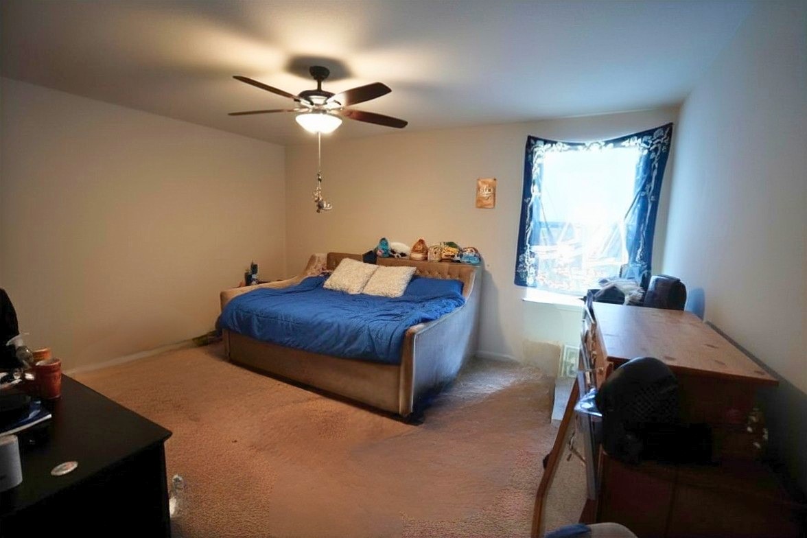 1835 Garnet Breeze Drive Rosharon, TX 77583 - Photo 13 of 19 a bedroom with a bed and window