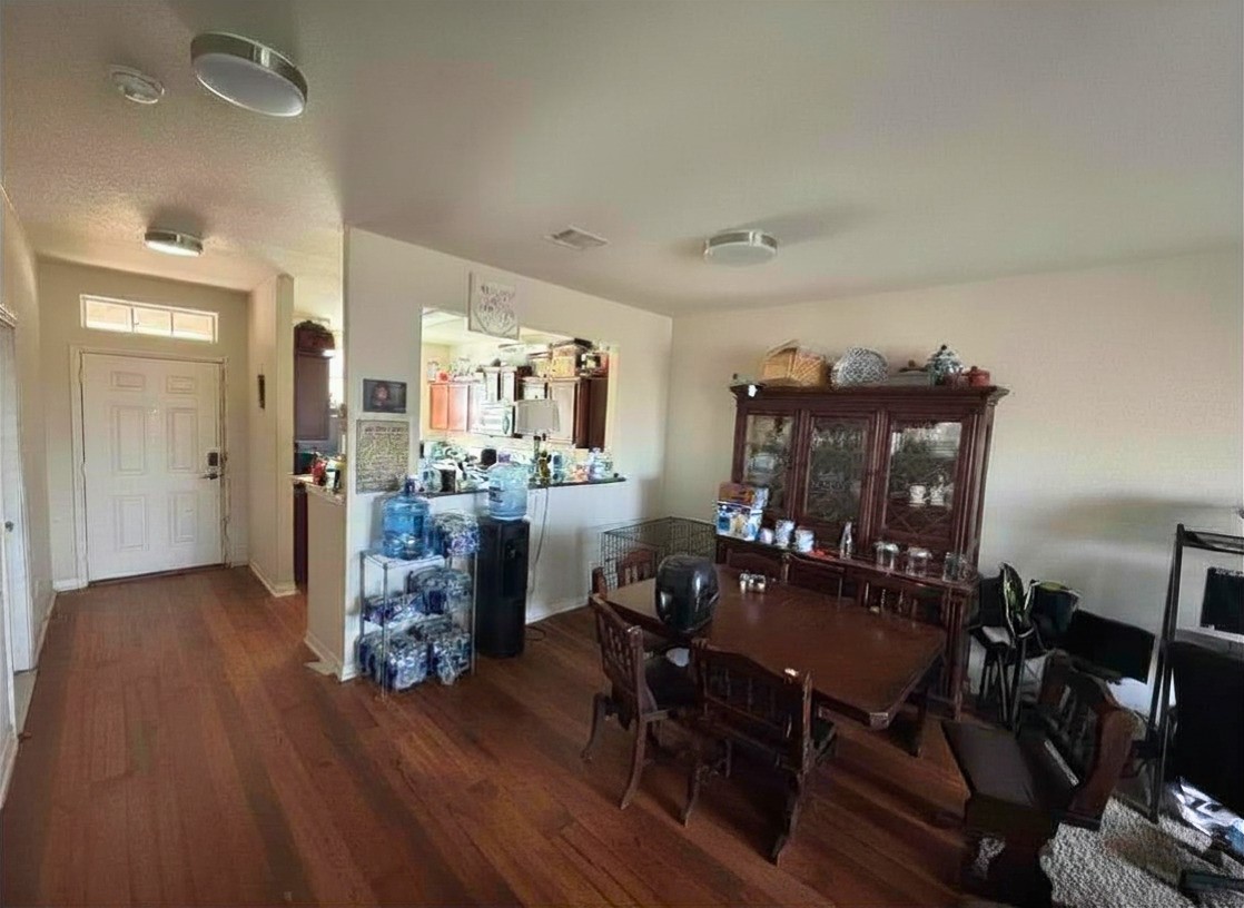 1835 Garnet Breeze Drive Rosharon, TX 77583 - Photo 5 of 19 a view of a dining room with furniture and wooden floor