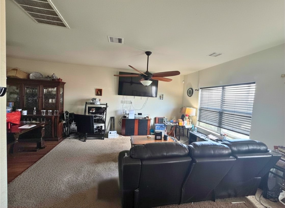 1835 Garnet Breeze Drive Rosharon, TX 77583 - Photo 7 of 19 a living room with furniture and a fireplace