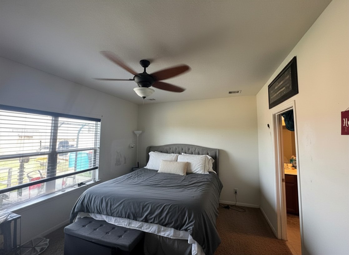 1835 Garnet Breeze Drive Rosharon, TX 77583 - Photo 8 of 19 a bedroom with a bed and a large window