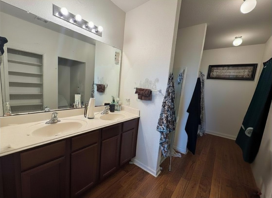 1835 Garnet Breeze Drive Rosharon, TX 77583 - Photo 10 of 19 a bathroom with a double vanity sink and a mirror