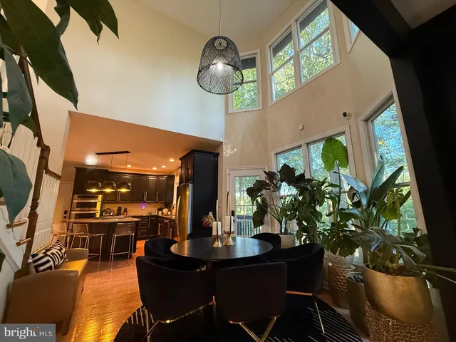 a kitchen with stainless steel appliances granite countertop a stove a refrigerator and a wooden cabinets