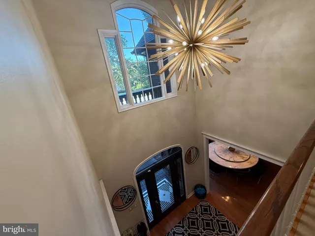 a bedroom with a bed window and a flat screen tv