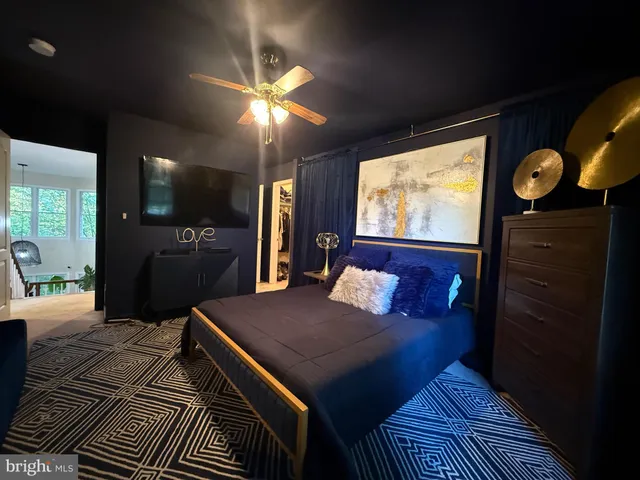 a view of a livingroom with furniture and a flat screen tv