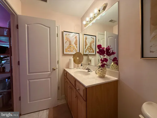 a bedroom with furniture and a large window