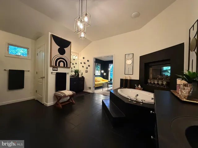 a view of a livingroom with furniture and a fireplace