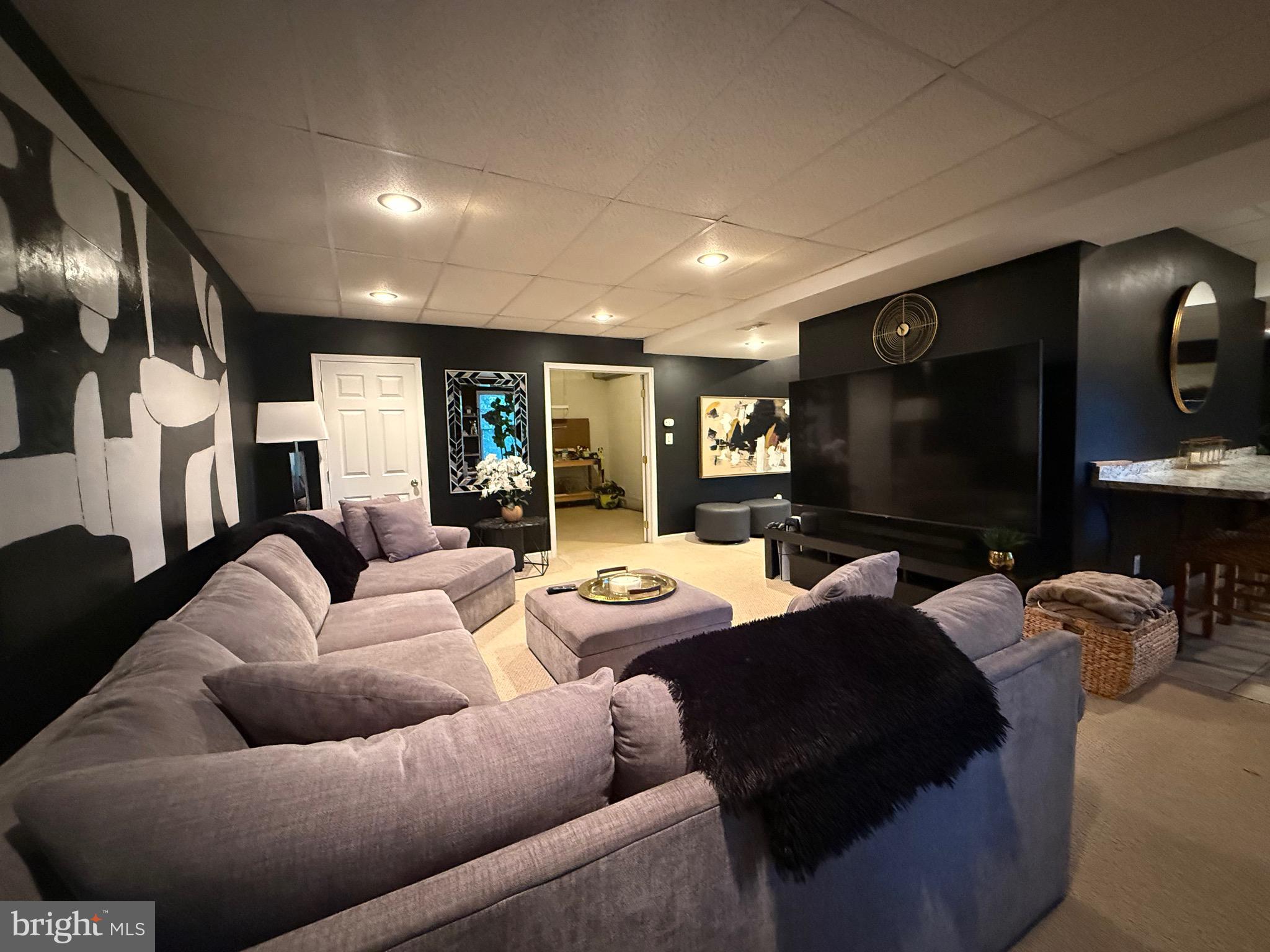 155 Erica Court Swedesboro, NJ 08085 - Photo 41 of 55 a living room with furniture and a flat screen tv