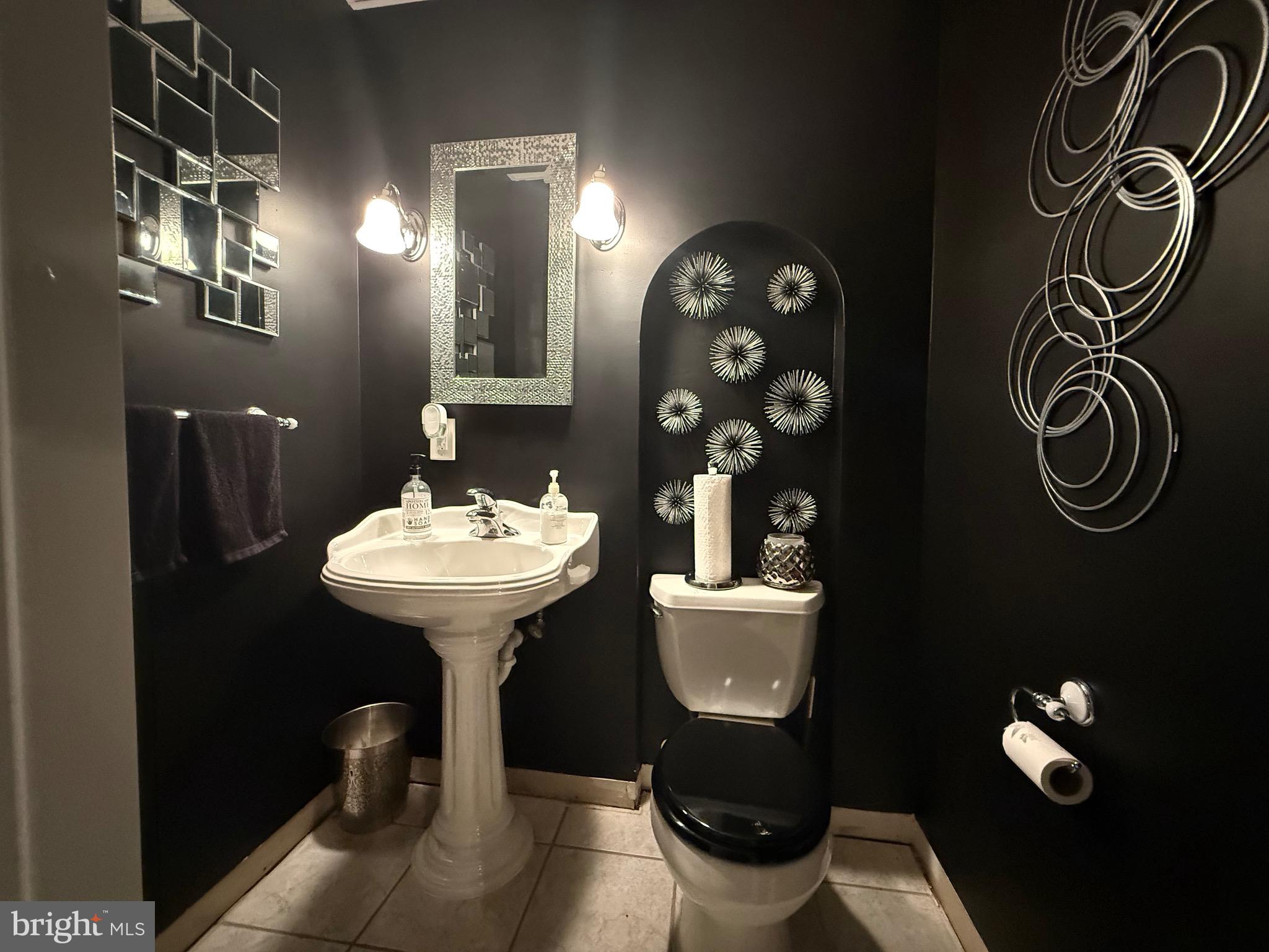 155 Erica Court Swedesboro, NJ 08085 - Photo 46 of 55 a bathroom with a toilet sink and mirror