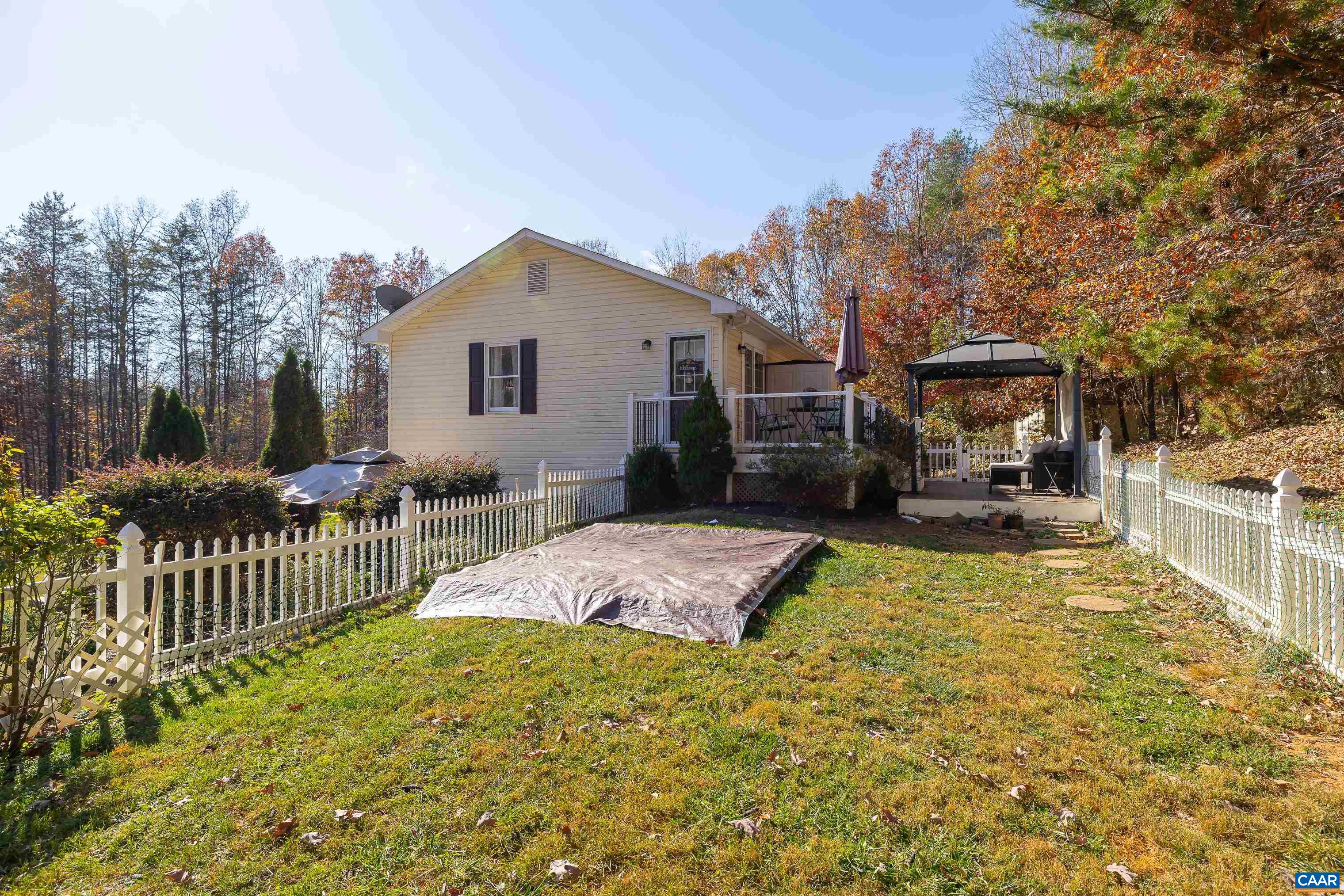 89 Fox Hollow Road Ruckersville, VA 22968 - Photo 32 of 37 a view of a house with backyard and sitting area