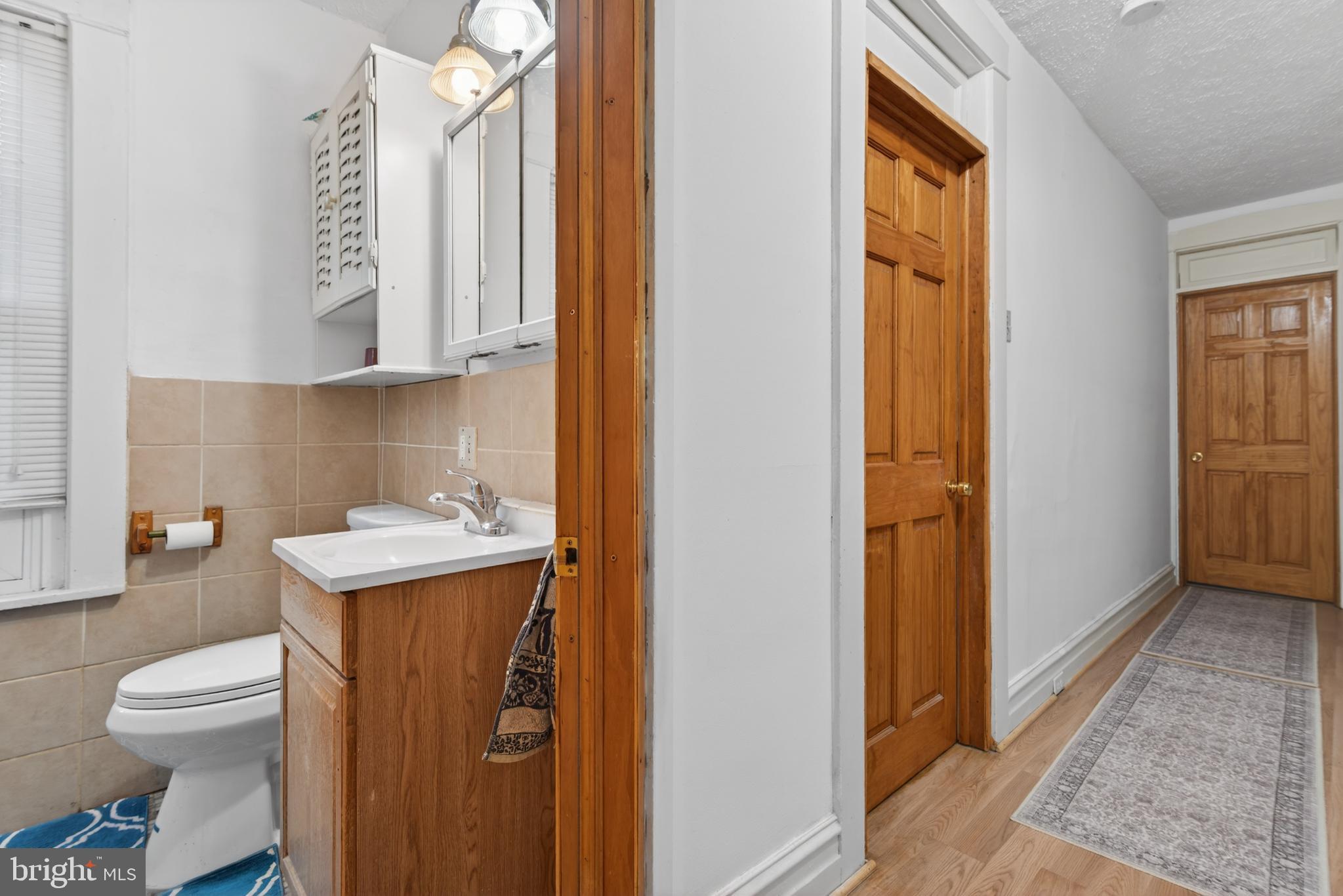 340 East Frederick Street Lancaster, PA 17602 - Photo 12 of 32 Charming hallway with modern bathroom access.