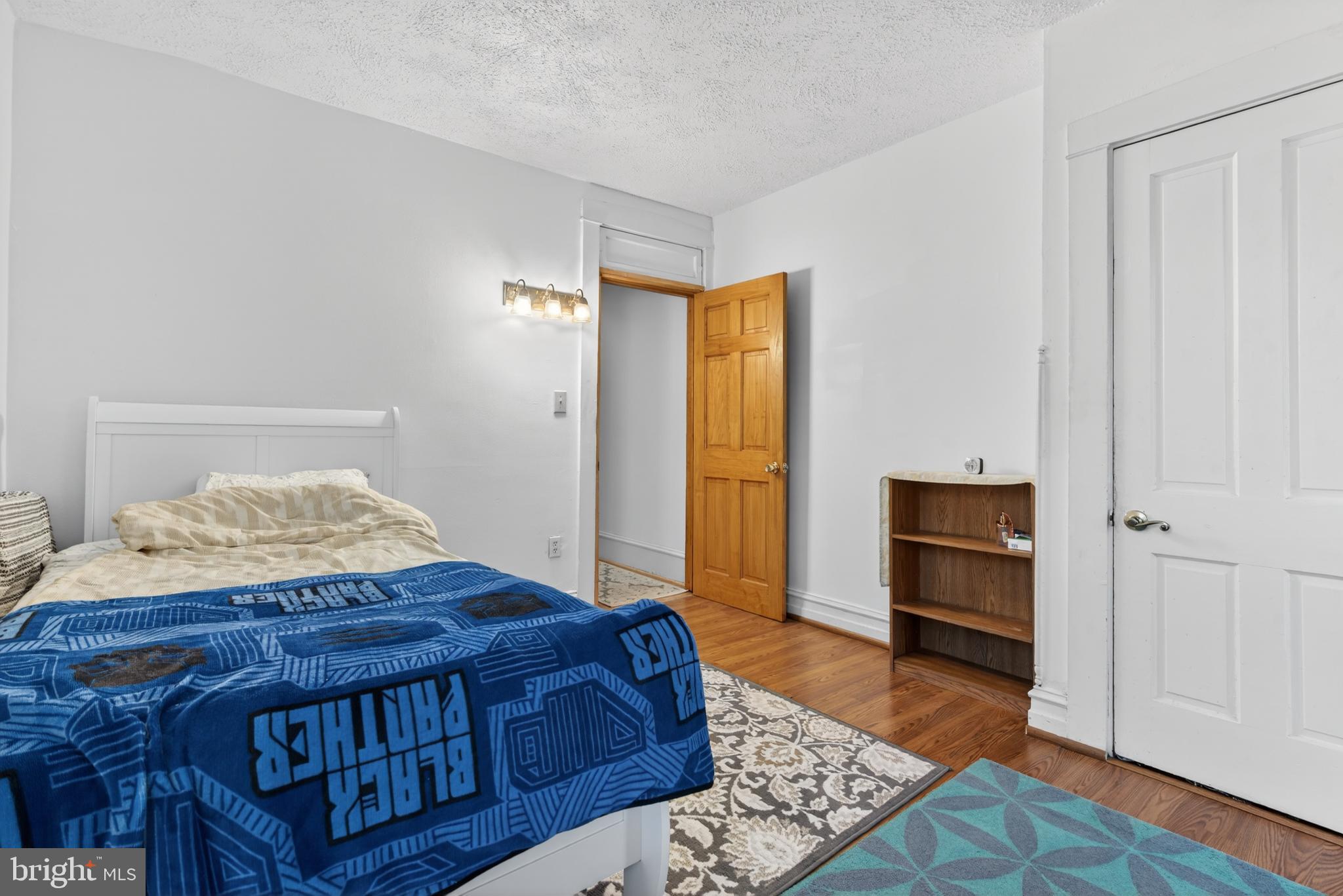 340 East Frederick Street Lancaster, PA 17602 - Photo 14 of 32 Cozy bedroom with warm wooden accents.