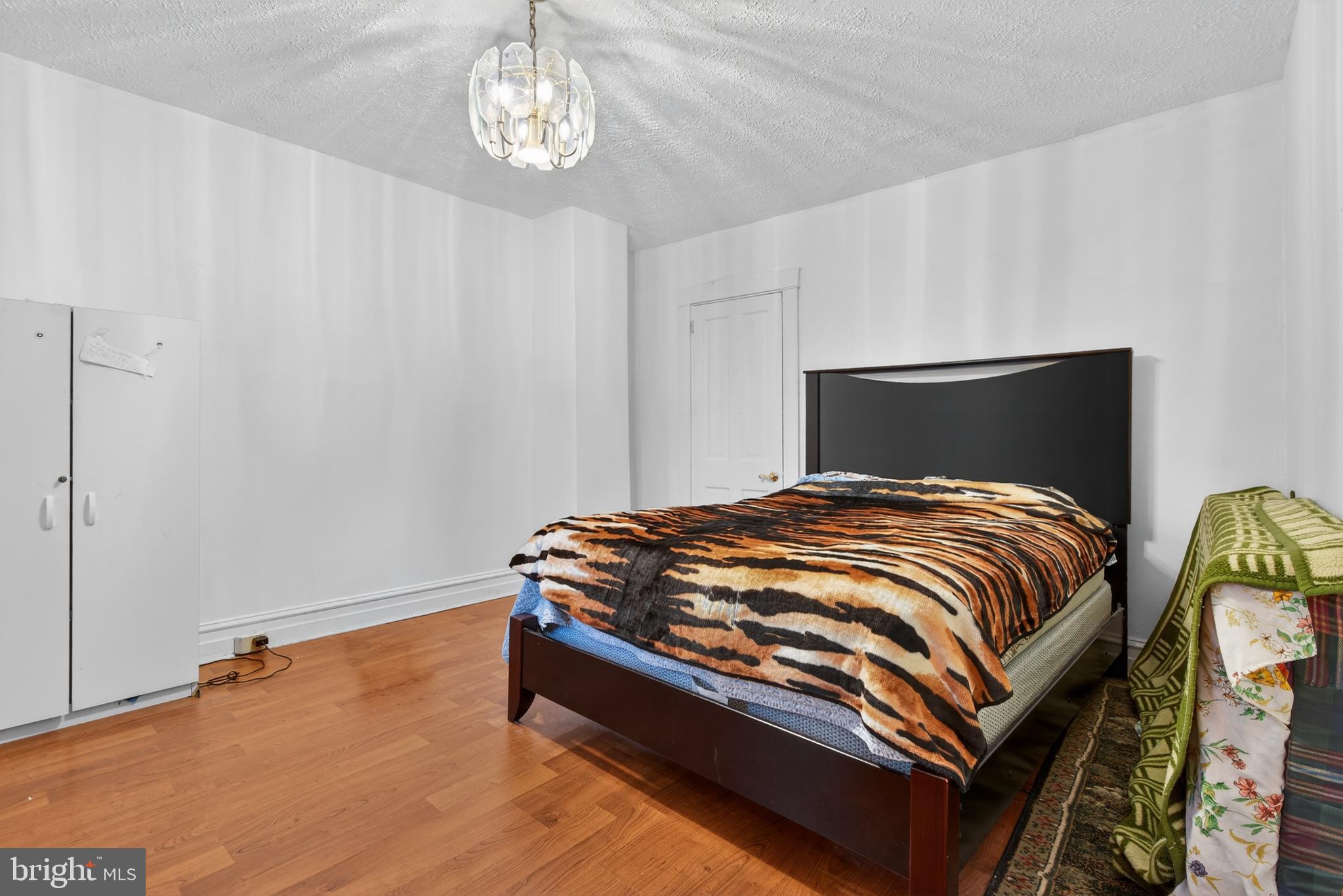 340 East Frederick Street Lancaster, PA 17602 - Photo 18 of 32 Cozy bedroom with warm wooden floors.