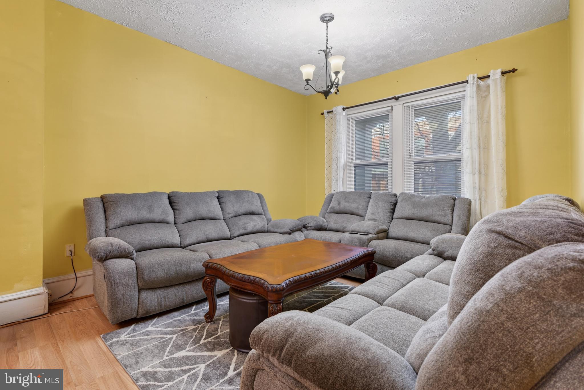 340 East Frederick Street Lancaster, PA 17602 - Photo 6 of 32 Cozy living space with warm yellow walls.