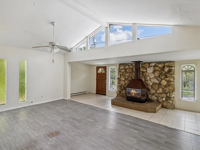 a view of a livingroom with furniture window and wooden floor