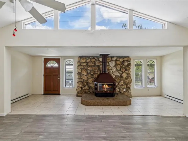 a view of living room with furniture and window