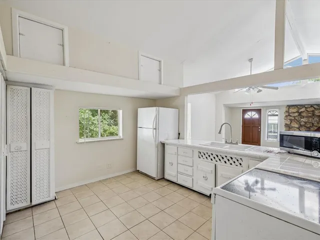 a view of kitchen with furniture and window