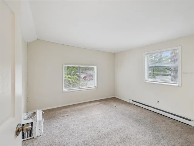 an empty room with windows