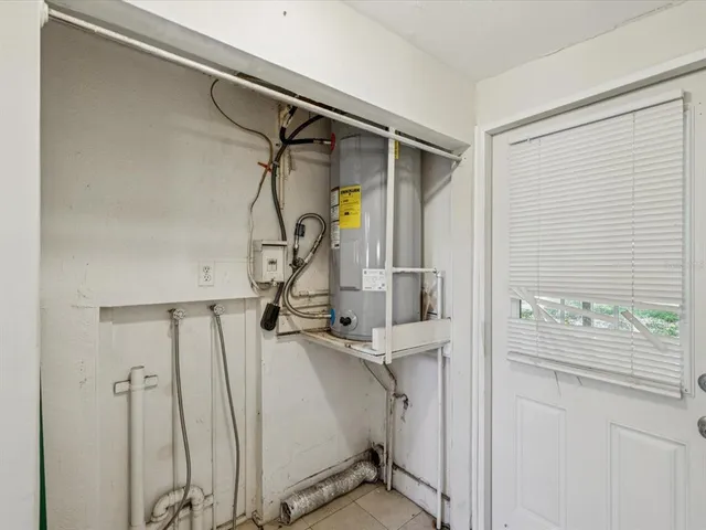 a view of a room with wooden floor and windows