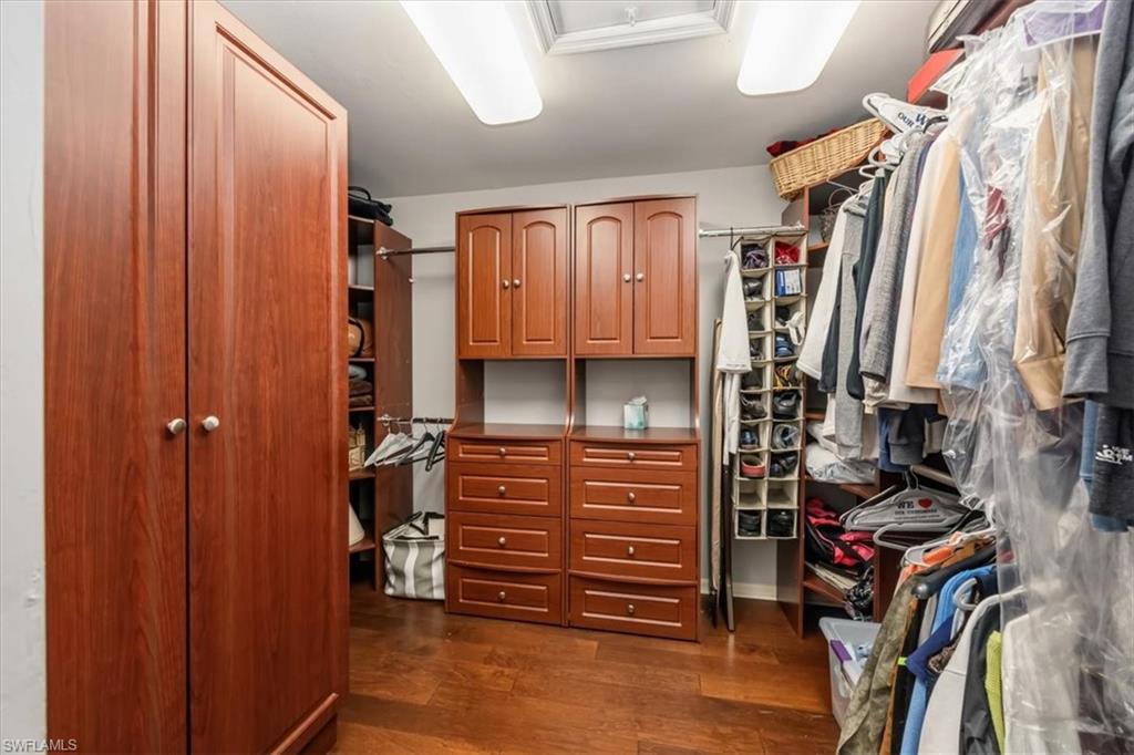 2066 Imperial Circle Naples, FL 34110 - Photo 16 of 29 a view of walk in closet with clothes