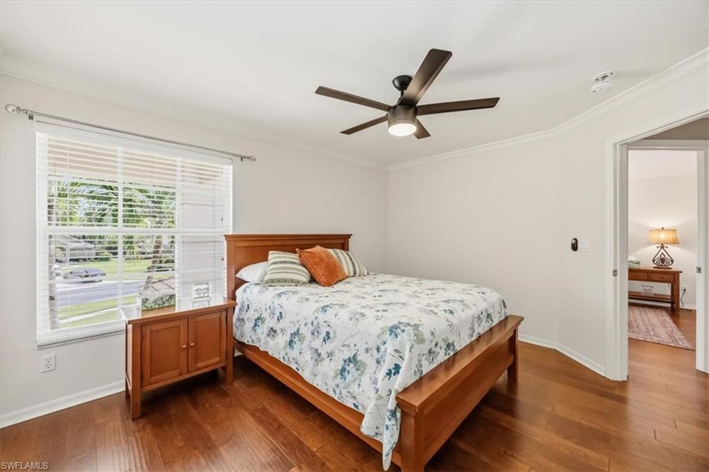 2066 Imperial Circle Naples, FL 34110 - Photo 24 of 29 a bedroom with a bed and window