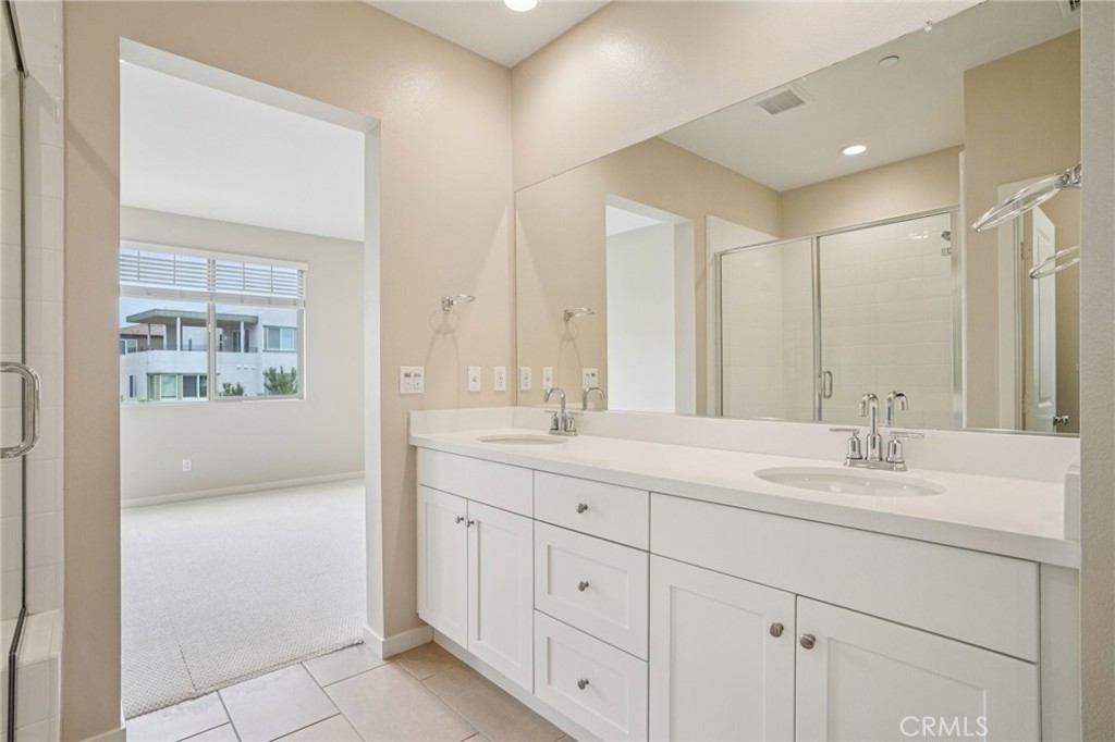143 Frame Irvine, CA 92618 - Photo 13 of 41 a bathroom with a sink double vanity and a mirror