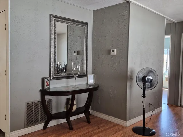 a view of a room with a table and chairs