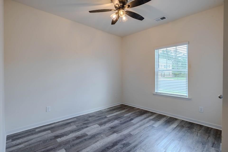 3 Oak Ridge Court Northeast Rome, GA 30165 - Photo 13 of 22 a view of an empty room with wooden floor and a window