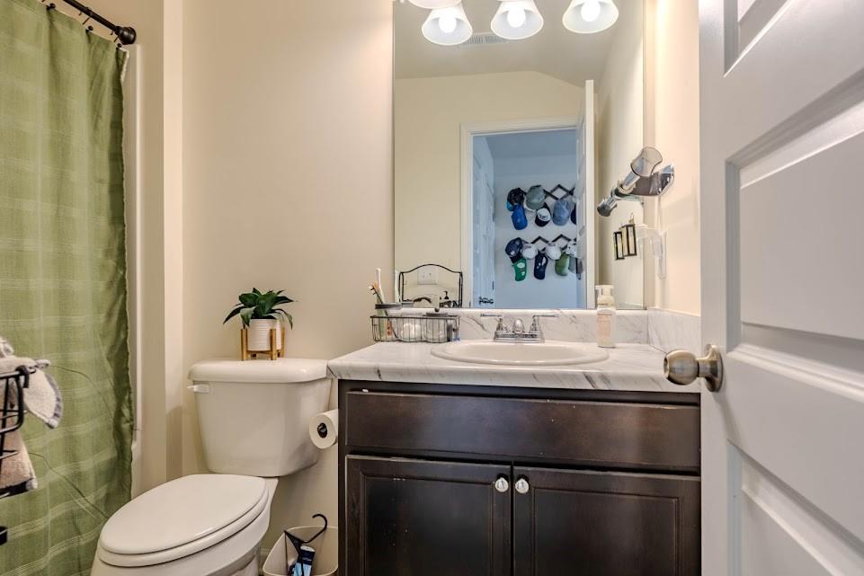 3 Oak Ridge Court Northeast Rome, GA 30165 - Photo 18 of 22 a bathroom with a sink and a toilet