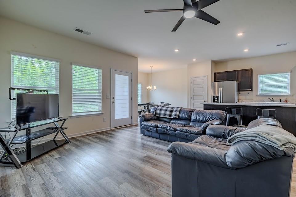 3 Oak Ridge Court Northeast Rome, GA 30165 - Photo 4 of 22 a living room with furniture and a flat screen tv
