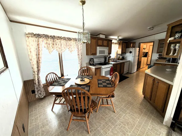 a kitchen with a refrigerator and a stove