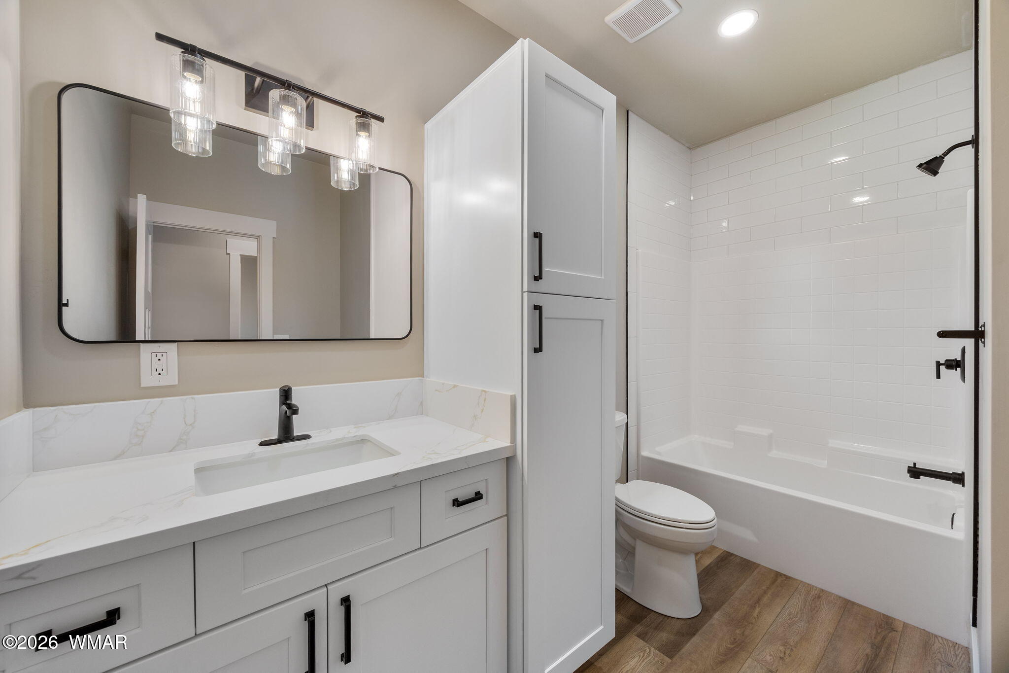 561 South Rock Ridge Drive Show Low, AZ 85901 - Photo 16 of 28 a bathroom with a toilet sink and mirror