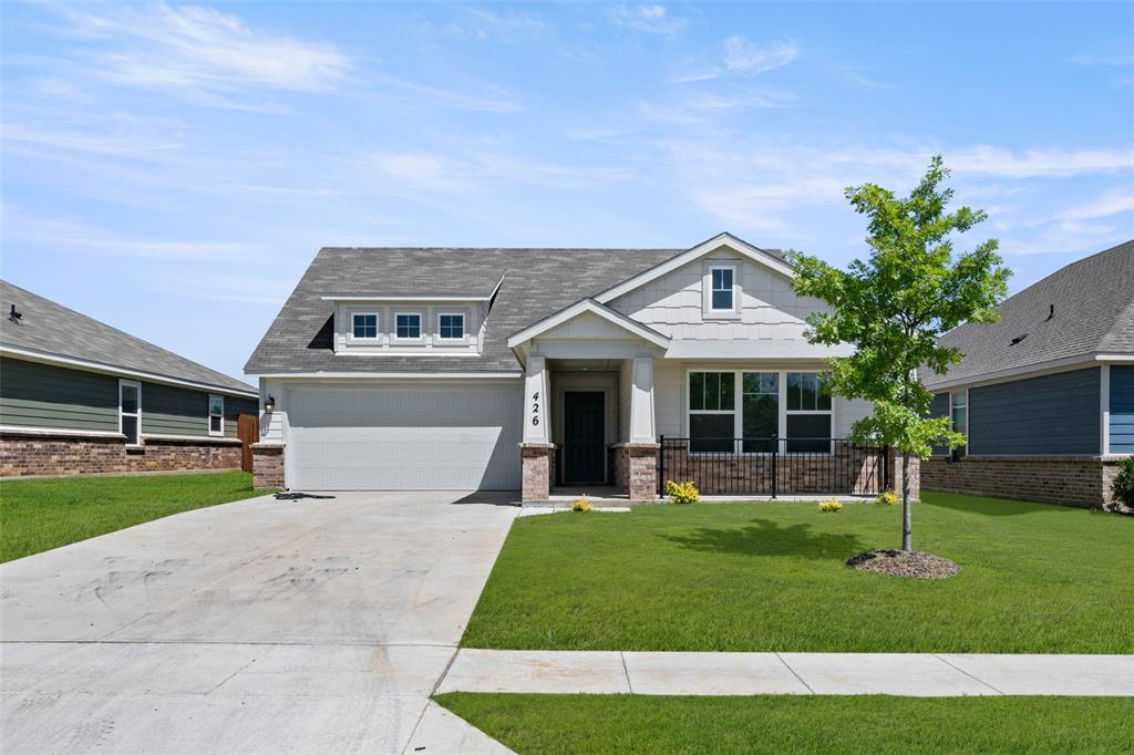 426 Rose Avenue Cleburne, TX 76033 - Photo 1 of 20 a front view of house with a garden