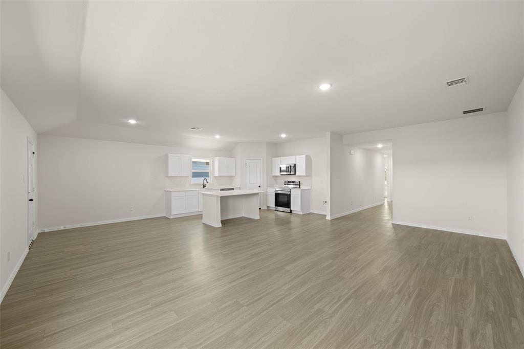 426 Rose Avenue Cleburne, TX 76033 - Photo 14 of 20 a view of kitchen with wooden floor