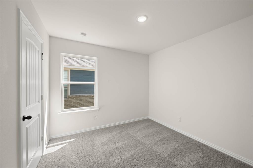 426 Rose Avenue Cleburne, TX 76033 - Photo 5 of 20 an empty room with a window