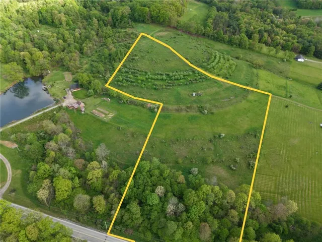 a view of a swimming pool with a yard