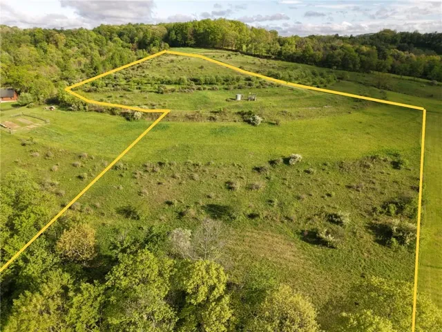 a view of a green field with clear sky