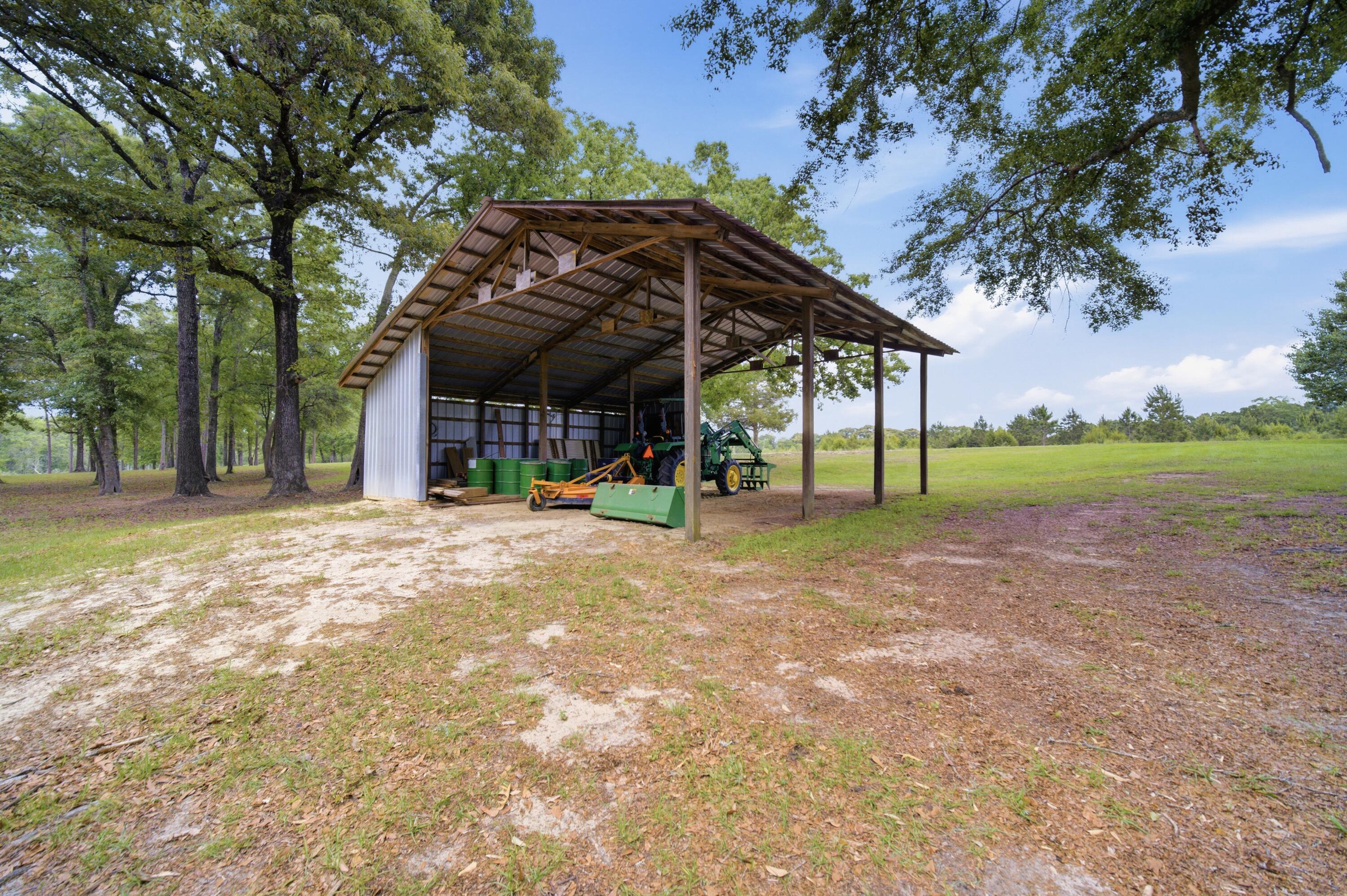 261 Wilkerson Road DeFuniak Springs, FL 32433 - Photo 71 of 76 a view of a house with a yard