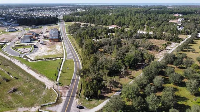 a view of a balcony with wooden floor and lake view
