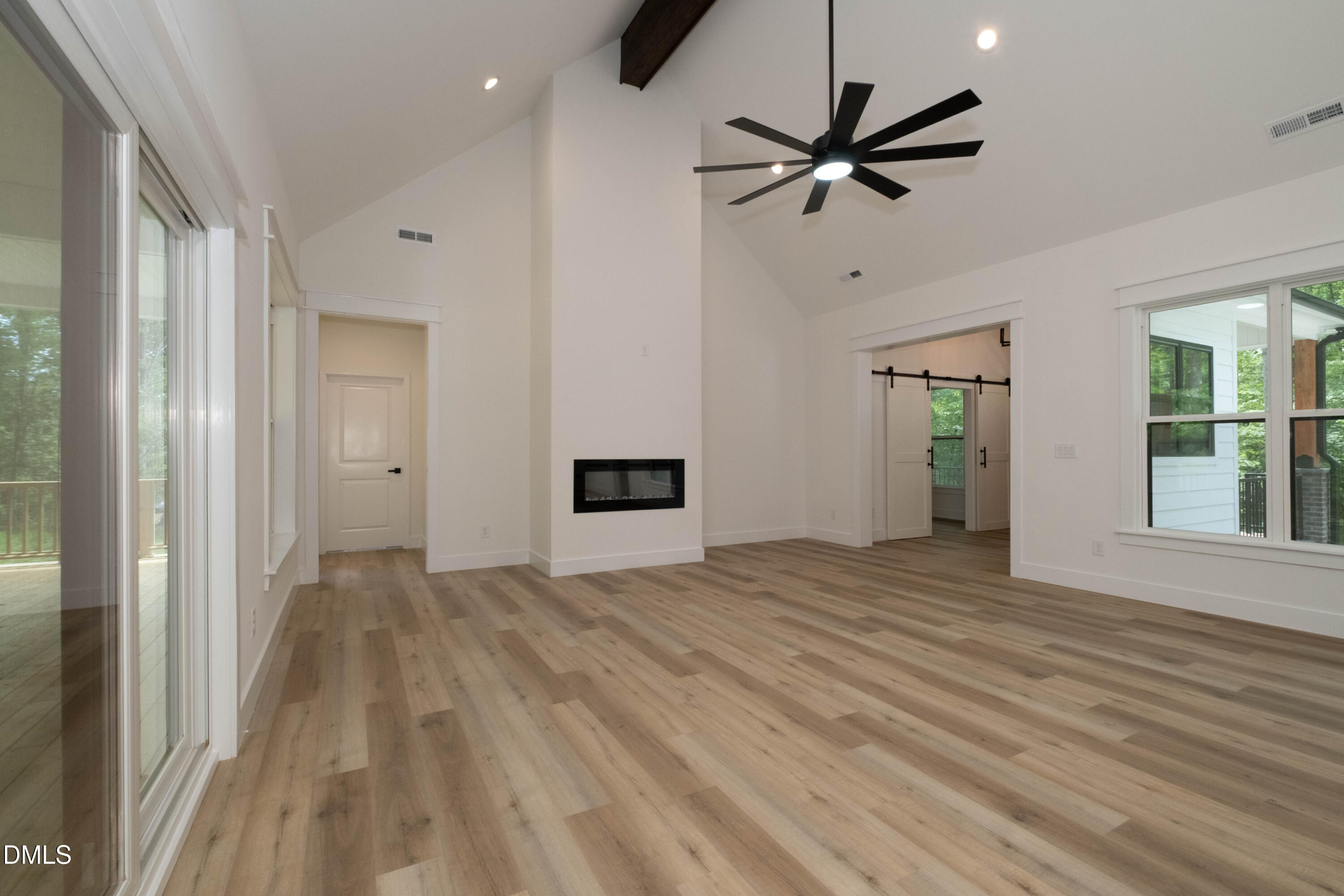 690 Oaks Lane Road Timberlake, NC 27583 - Photo 12 of 31 a view of empty room with wooden floor and ceiling fan