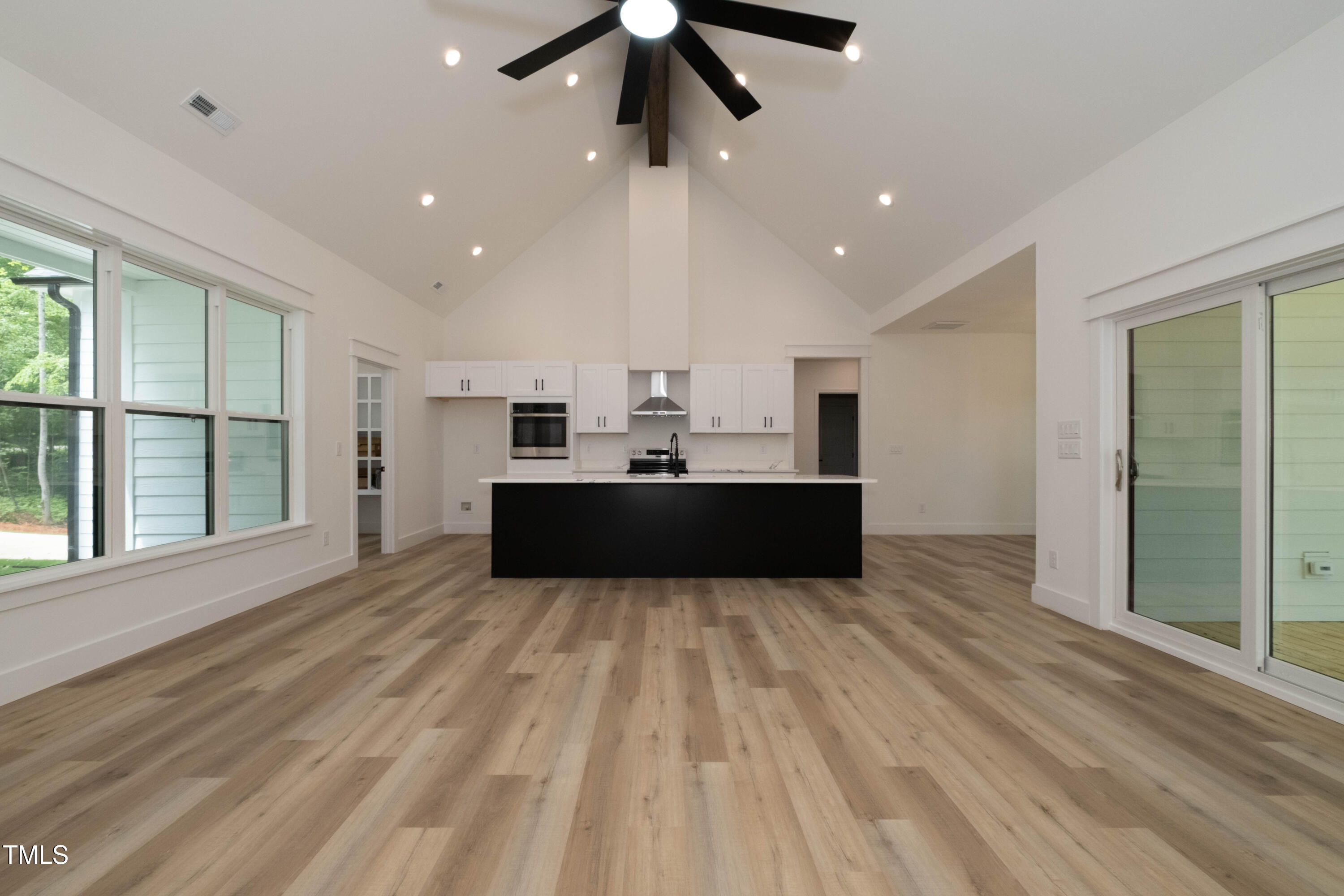 690 Oaks Lane Road Timberlake, NC 27583 - Photo 13 of 31 a view of kitchen with wooden floor and window