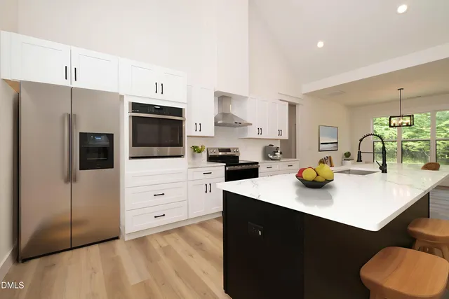 a kitchen with a sink a stove and refrigerator