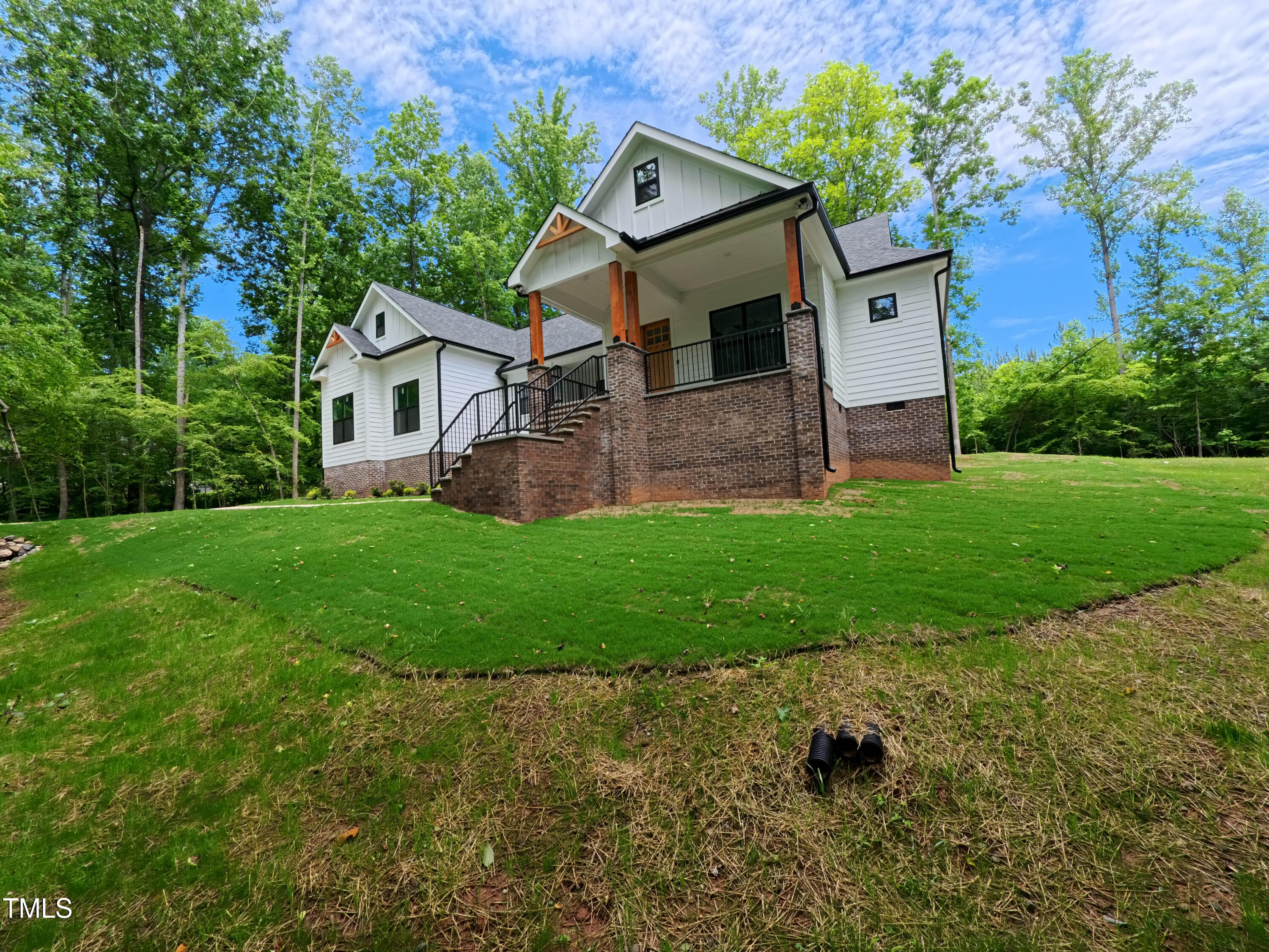 690 Oaks Lane Road Timberlake, NC 27583 - Photo 2 of 31 a front view of a house with a yard