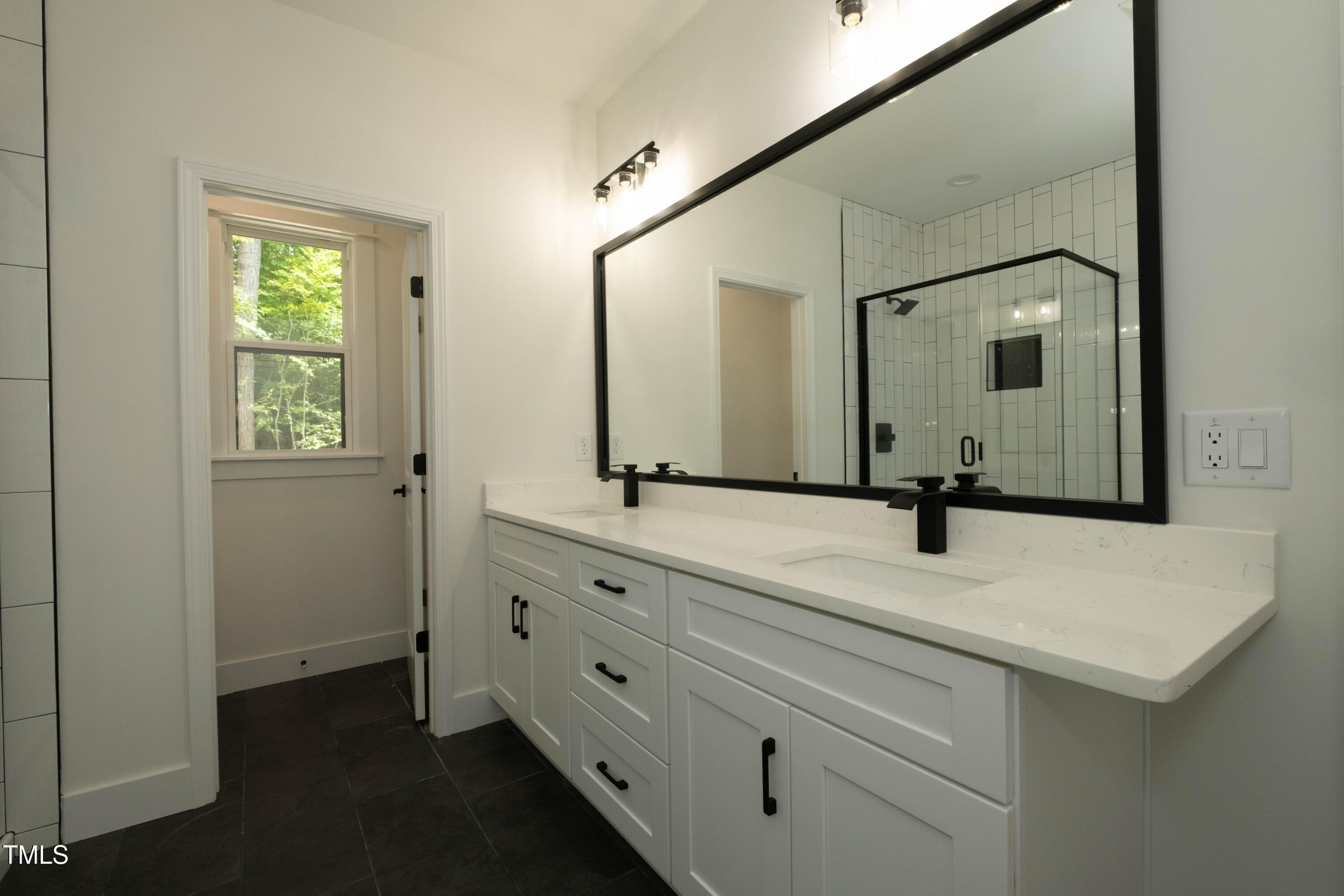 690 Oaks Lane Road Timberlake, NC 27583 - Photo 22 of 31 a bathroom with a sink and two mirror