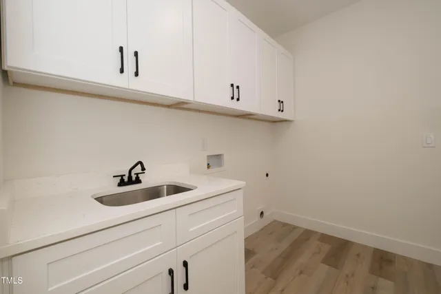 a kitchen with a sink and cabinets
