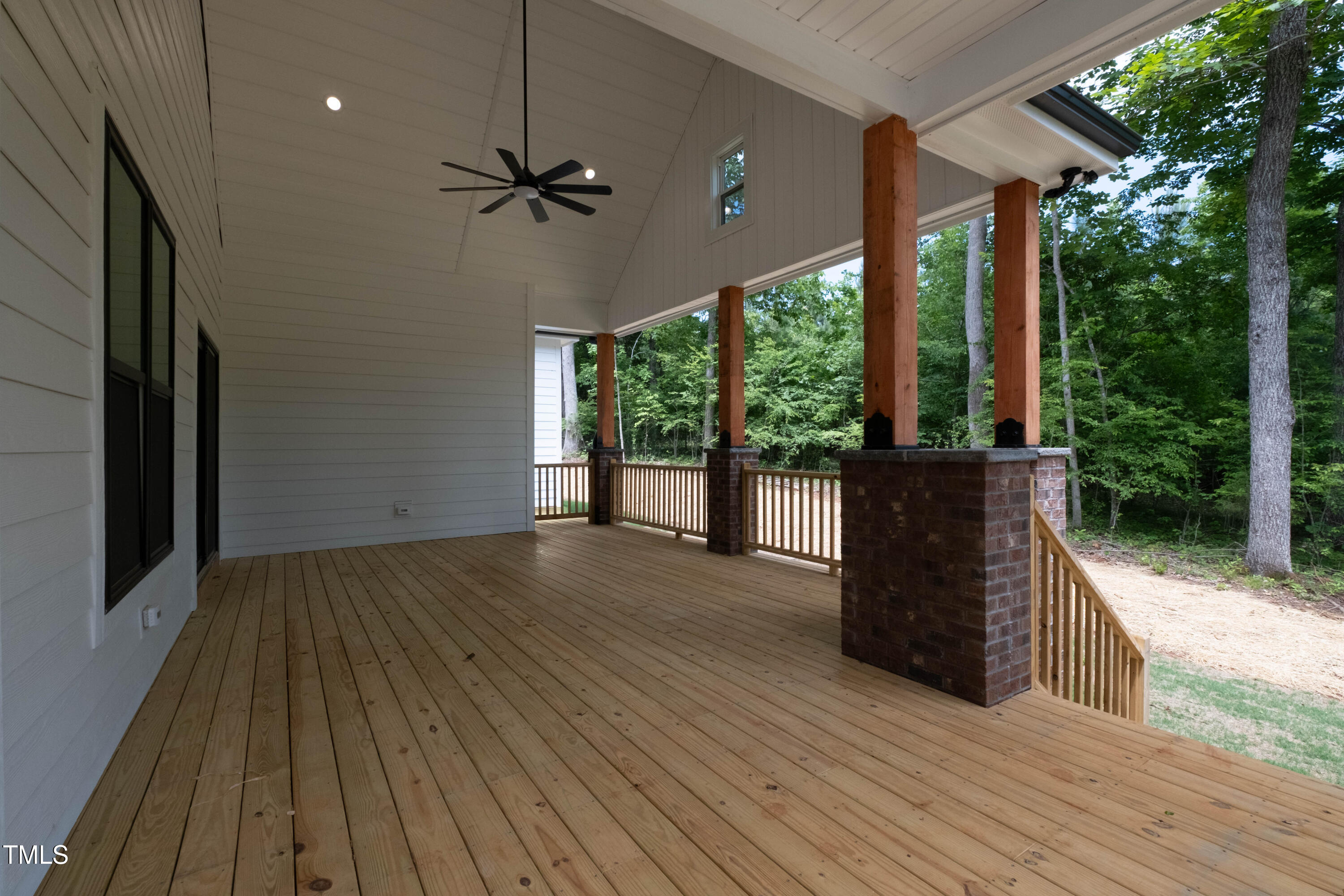 690 Oaks Lane Road Timberlake, NC 27583 - Photo 29 of 31 a view of a porch with wooden floor and outdoor space