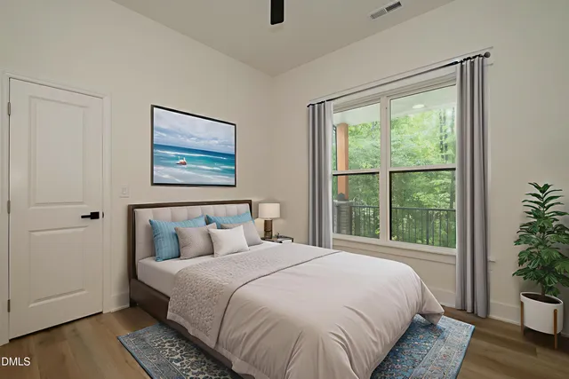 a bedroom with a large bed and a window